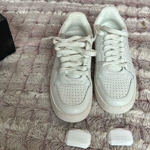 Kate Spade Bolt sneaker Store Display: Missing insole on the right sneaker.